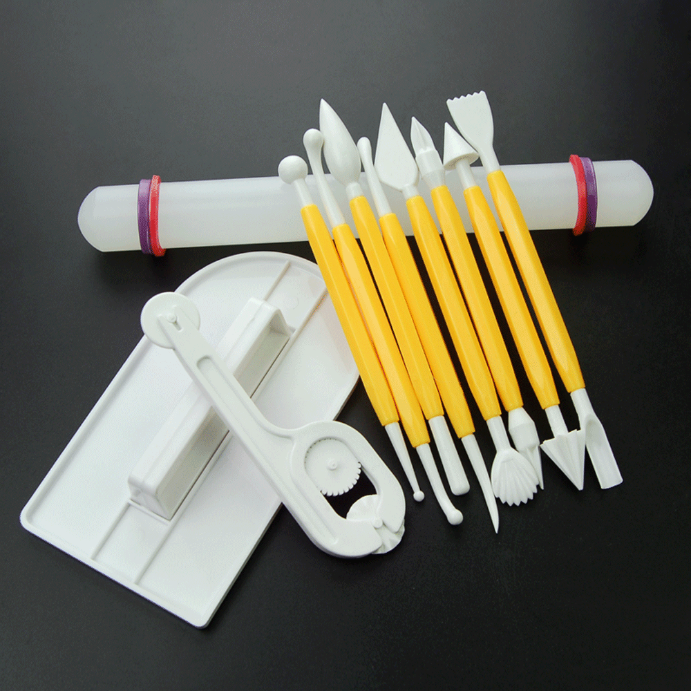 The Multi-Purpose Carving Knives Sculpting Tools kit placed next to a finished sugar art flower, showcasing real DIY sugar crafting result