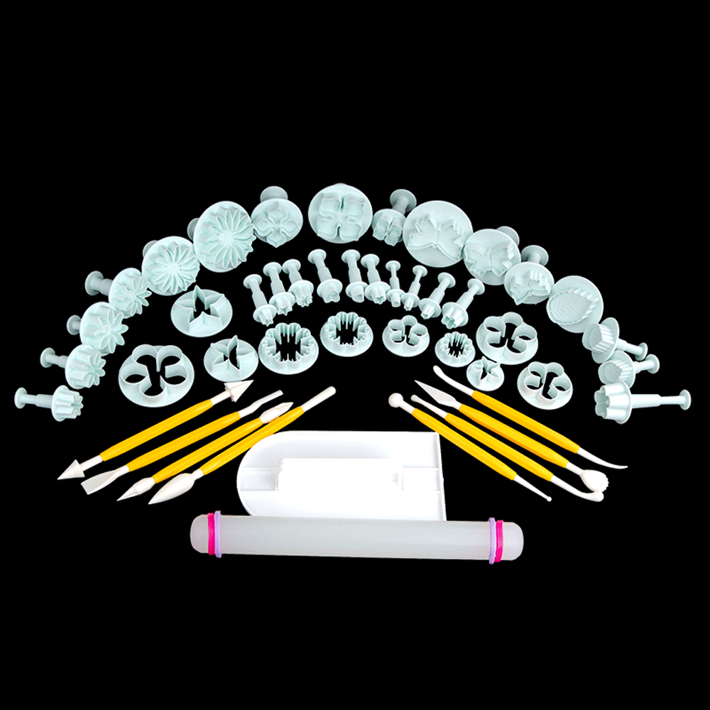 Close-up of a sculpting tool from the set carving intricate patterns into sugar paste, highlighting precision for DIY sugar art