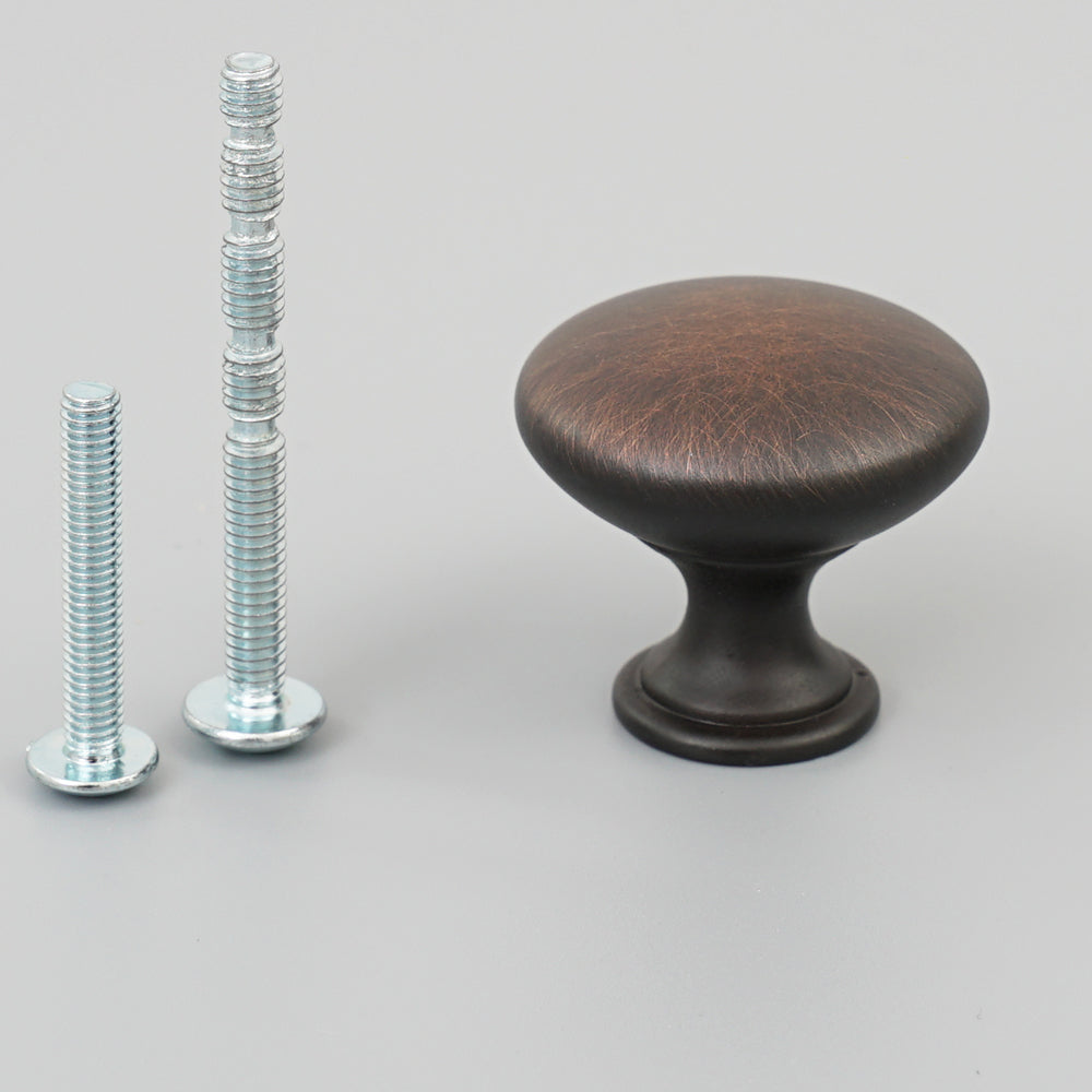 Polished chrome single hole drawer pull handle on furniture