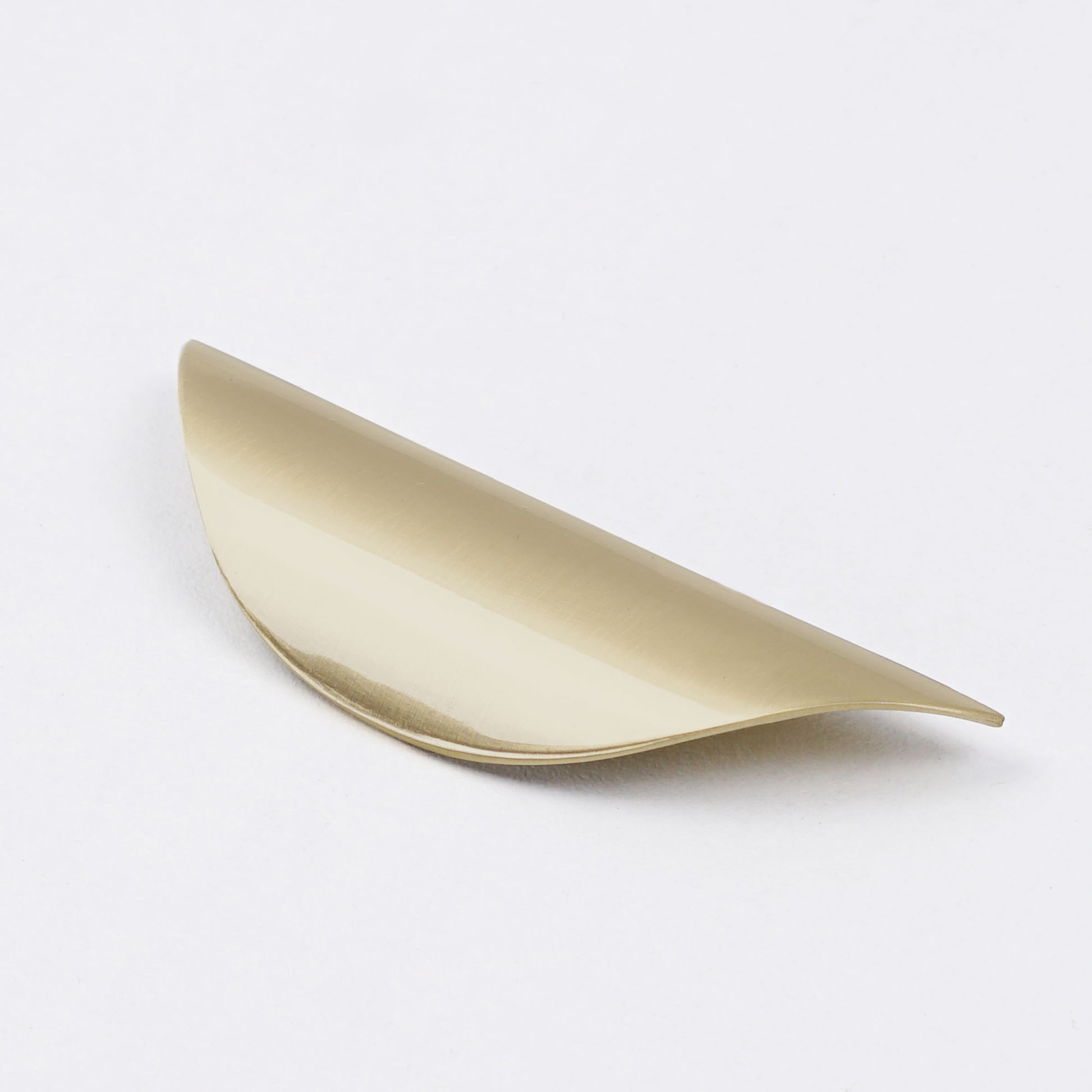 Stylish brushed gold arc pull for dresser and cupboards.