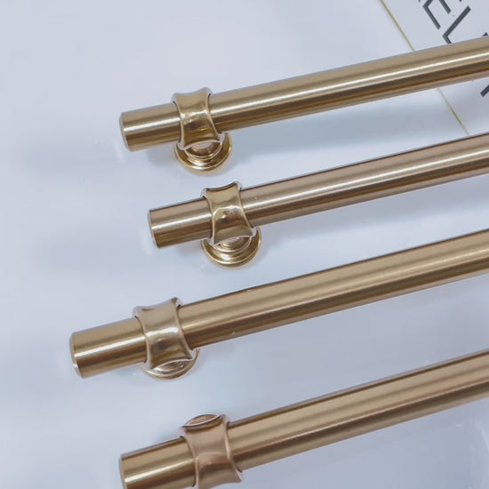 “Real-life demonstration of champagne bronze cabinet handles on bathroom and bedroom furniture, highlighting durability and elegant design.”