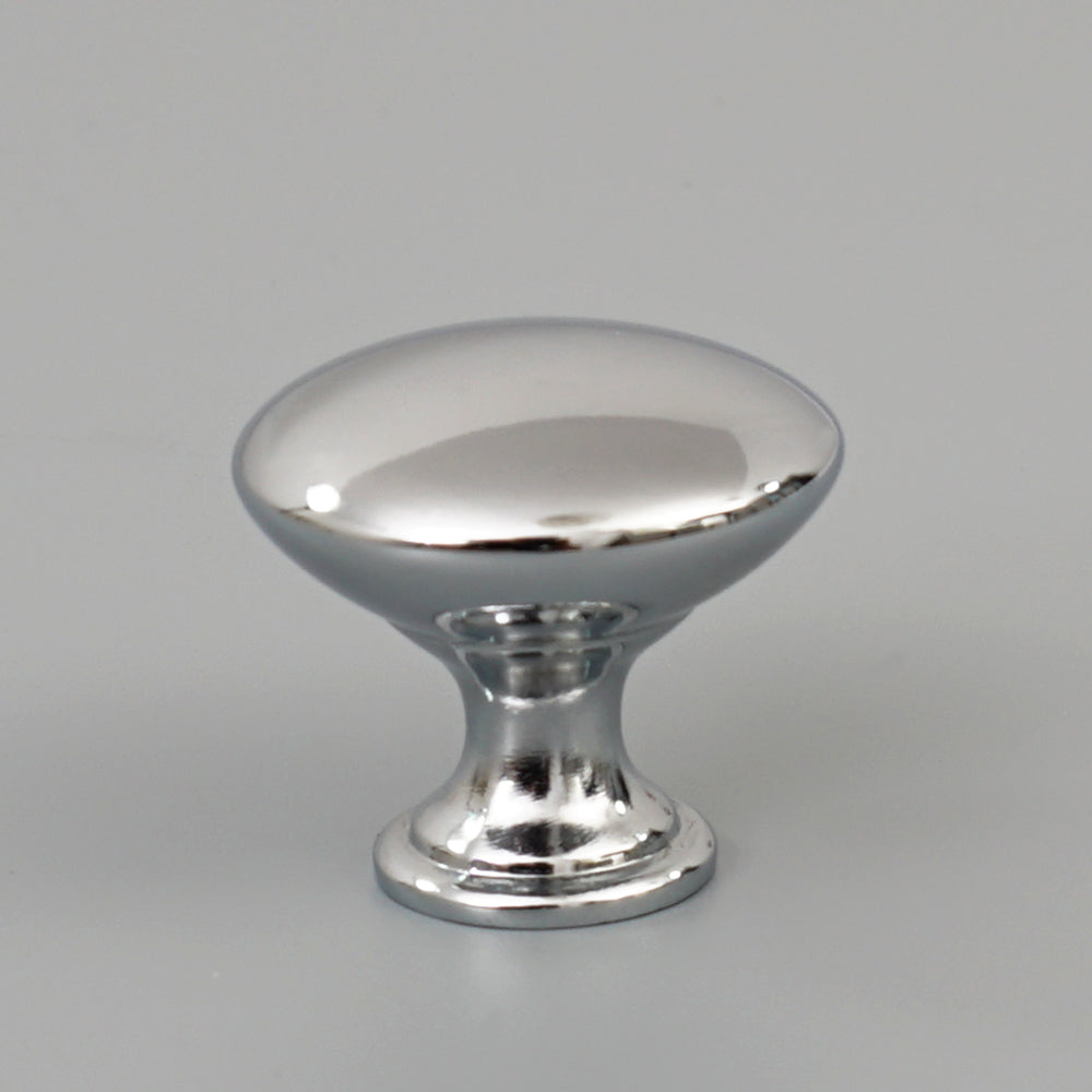 Single hole drawer pull handle mounted on wooden dresser